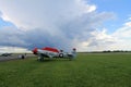 Old fighter plane on green field side view