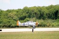 Old fighter plane landing Royalty Free Stock Photo