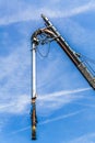 Old filling pipe ship against a blue sky with white clouds Royalty Free Stock Photo