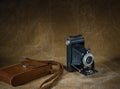 Old film camera Kodak Brownie with a case shot in retro style Royalty Free Stock Photo