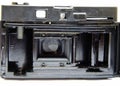 Old film camera. Rarity camera on a white background. A camera in muse hands, cocking. Soviet photographic equipment. The camera Royalty Free Stock Photo