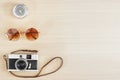 Old film camera , sunglasses and compass on wood table with free space for text. Travel and photography background concept. Happy Royalty Free Stock Photo