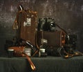 Old film cameras, photographic film, leather cases for photographic equipment. Old photographic equipment. Royalty Free Stock Photo