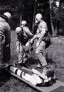 An old film photo of the training of sanitary squads in 1989 to provide first aid and evacuation from the lesion in the village of