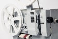 Old film projector isolated on a white background Royalty Free Stock Photo