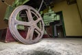 Old film reel lie in front of a historical projector in a abandoned cinema.