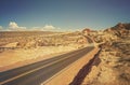 Old film retro style winding desert road. Royalty Free Stock Photo