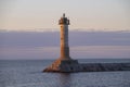 The old Finnish lighthouse Vuohensalo, twilight. Motornaya Bay, Ladoga lake. Leningrad region Royalty Free Stock Photo