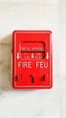 Old fire alarm box on the marble wall Royalty Free Stock Photo