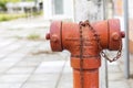 Old fire hydrant and rusty chain over blurred park background Royalty Free Stock Photo