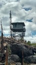 Old Fire Lookout Tower With Burned Trees