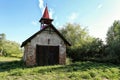 Old firehouse with wooden gate and red roof Royalty Free Stock Photo