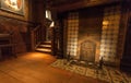 Old fireplace in room with wooden furniture, in printing museum of Plantin-Moretus, UNESCO World Heritage Site