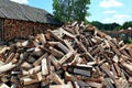 Old firewood shed and a lot of chopped logs Royalty Free Stock Photo