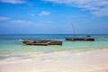 Old fisher boats on the beach during low tide on ocean Royalty Free Stock Photo