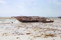 Old fisher boats on the beach during low tide on ocean Royalty Free Stock Photo