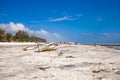 Old fisher boats on the beach during low tide on ocean Royalty Free Stock Photo