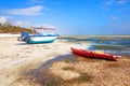 Old fisher boats on the beach during low tide on ocean Royalty Free Stock Photo