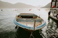 Old fisherman boat in sea bay with mountains background Royalty Free Stock Photo