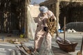 Old fisherman with his gear