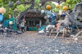 Old fishermans cottage surrounded with nautical and fishing bits and pieces along a tropical beach