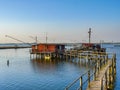 Old fishermans hut with wooden pier in Comacchio Italy Royalty Free Stock Photo