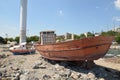 Old fishing boat abandoned on the shore waitng for repair at the seaport. Istanbul, Turkey Royalty Free Stock Photo