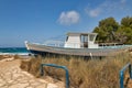 Old fishing boat on Ammos Kambouri beach. Ayia Napa, Cyprus Royalty Free Stock Photo