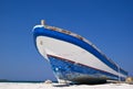 Old fishing boat on a Caribbean beach. Royalty Free Stock Photo