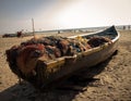 Old fishing boat with fishing net in a beach Royalty Free Stock Photo