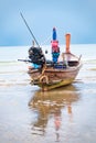 Old fishing boat on the Patong beach waiting for high tide in Phuket, Thailand Royalty Free Stock Photo