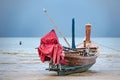 Old fishing boat on the Patong beach waiting for high tide in Phuket, Thailand Royalty Free Stock Photo