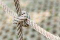 Old fishing boat rope with a Tied Knot Royalty Free Stock Photo