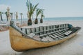 Old fishing boat on sand with blue sky and water Royalty Free Stock Photo