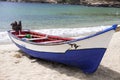 Old fishing boat on the shore. Boat with nets waiting for fishermen on the beach of Cape Verde