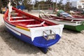 Old fishing boat on the shore. Boat with nets waiting for fishermen on the beach of Cape Verde