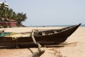 Old fishing boat standing on the sandy beach. India, Goa Royalty Free Stock Photo