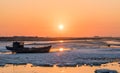 Old fishing boat at sunset time Royalty Free Stock Photo