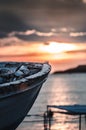 Old fishing boat on sunset, vertical