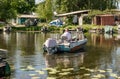 Old fishing boat and swampy banks of the Dnieper River. River fishing in Eastern Europe Royalty Free Stock Photo