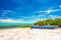Old fishing boat on a tropical beach at the Royalty Free Stock Photo