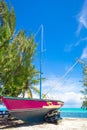 Old fishing boat on a tropical beach at the Royalty Free Stock Photo