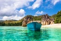 Old fishing boat on Tropical beach at Curieuse island Seychelles