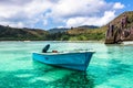 Old fishing boat on Tropical beach at Curieuse island Seychelles Royalty Free Stock Photo