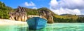 Old fishing boat on Tropical beach at Curieuse island Seychelles Royalty Free Stock Photo