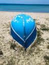 old fishing boat upside down on sand beach Royalty Free Stock Photo