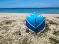 old fishing boat upside down on sand beach Royalty Free Stock Photo