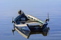 Old fishing boats with bright colors at dawn on the lake Royalty Free Stock Photo