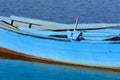 Old fishing boats with bright colors at dawn on the lake Royalty Free Stock Photo