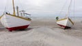 Old Fishing Boats Lined Up Ashore on Thorup Strand Beach in Denmark